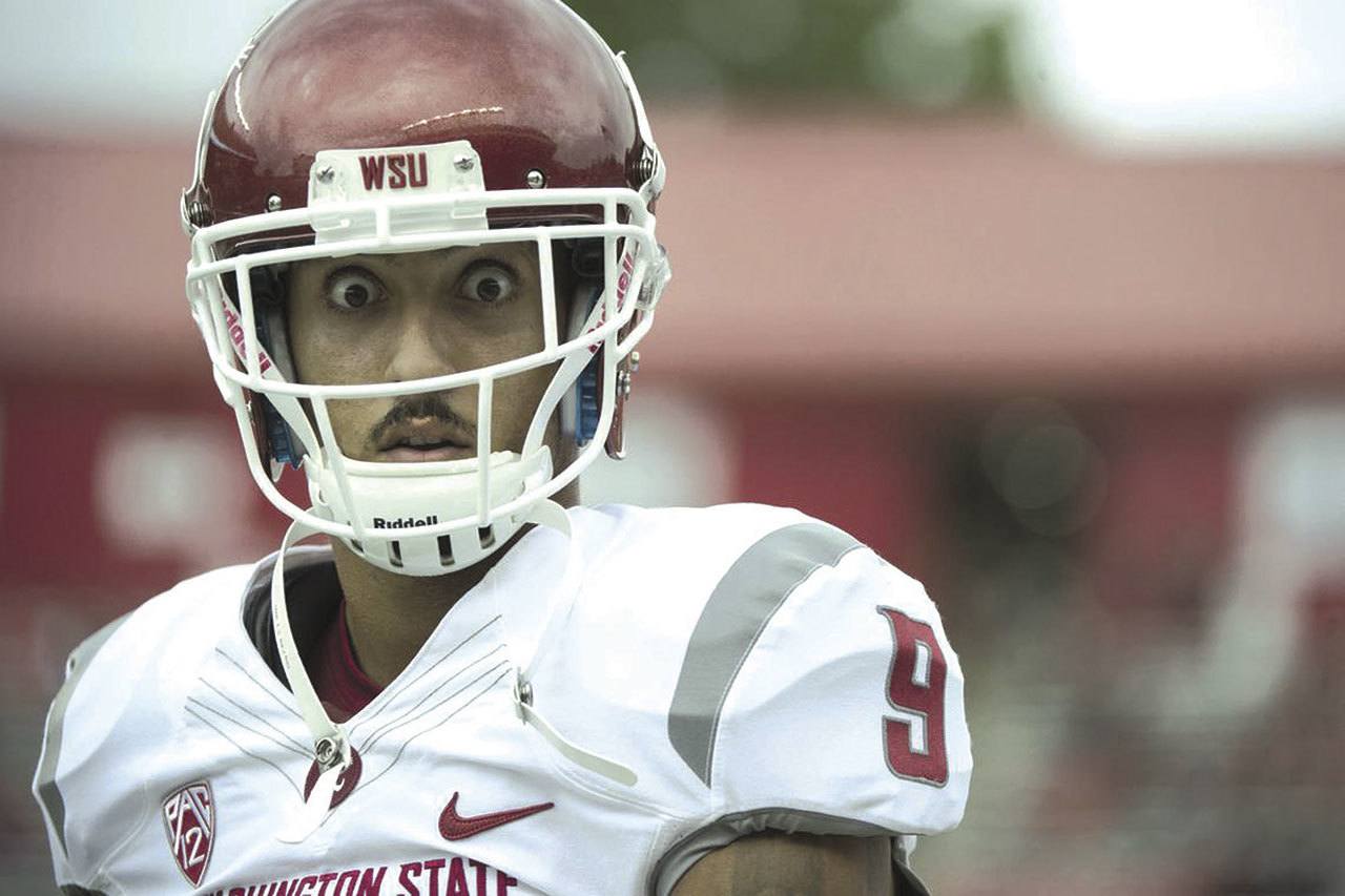 The Associated Press Washington State wide receiver Gabe Marks eyes the camera during the Cougars’ 37-34 victory over Rutgers last season. Marks caught 104 passes for 1,192 yards and 15 touchdowns in 2015.