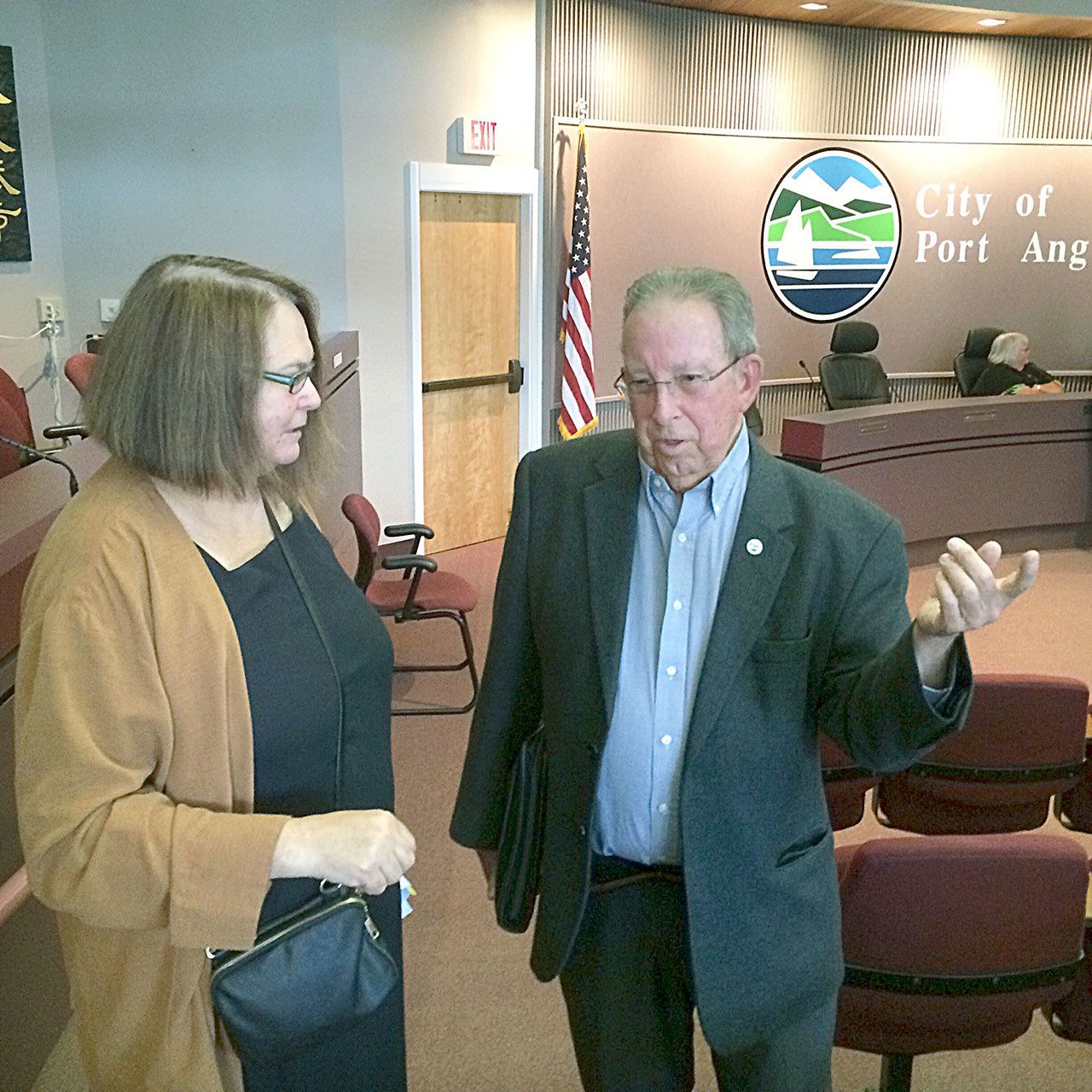 Mayor Patrick Downie and Marolee Smith chat at City Hall in Port Angeles on Friday after Smith dropped her ethics complaint against Downie. (Paul Gottlieb/Peninsula Daily News)