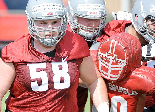 Washington State lineman Riley Sorensen (58) works out with teammates during practice on Saturday, Aug. 6, 2016, at Sacajawea Junior High School in Lewiston, Idaho.