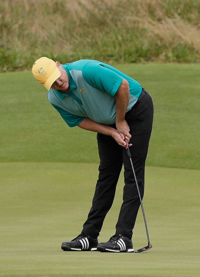 The Associated Press                                Marcus Fraser of Australia watches his putt on the 16th hole during the first round of the men’s golf event at the 2016 Summer Olympics in Rio de Janeiro, Brazil. Fraser leads the tournament after shooting an 8-under-par 64.