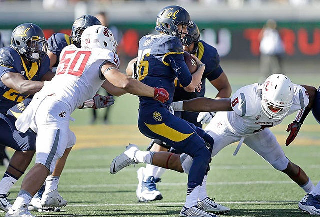 The Associated Press Washington State’s Hercules Mata’afa (50) and Jeremiah Allison, right, pressure California quarterback Jared Goff during the second half.