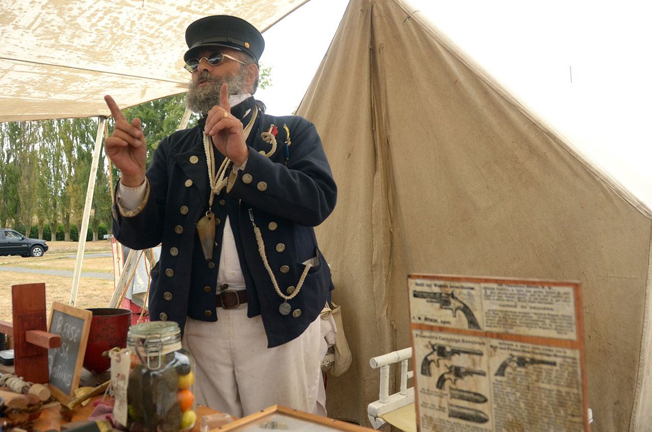 James Genovesa of the USS Tahoma Navy re-enactors group explains how Civil War era sailors would navigate the seas. Genovesa was one of many re-enactors at Fort Worden throughout Labor Day weekend. (Cydney McFarland/Peninsula Daily News)