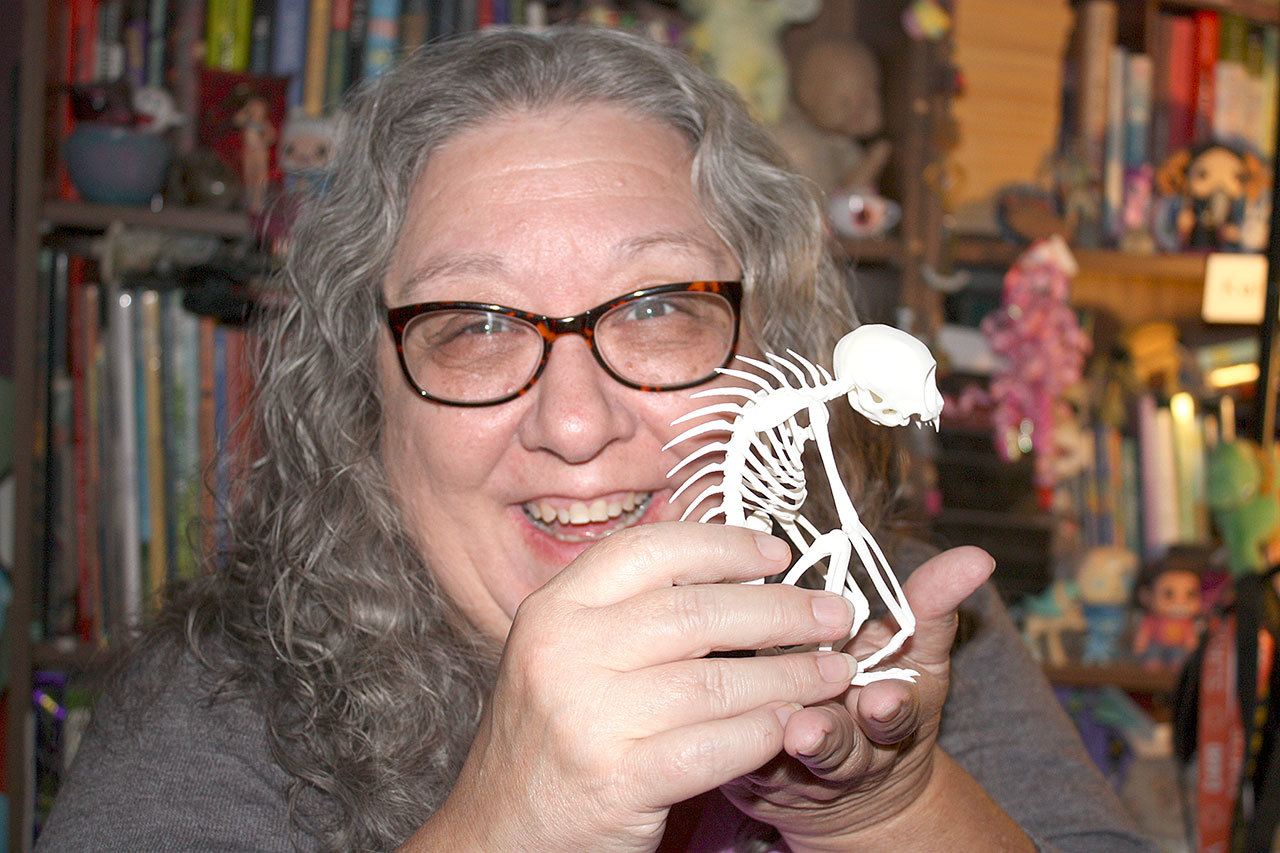 Kelly Milner Halls holds a 3-D printer version of a chupacabras skeleton, an animal said to be unknown to science and systemically killing animals in places such as Puerto Rico, Miami, Nicaragua, Chile and Mexico.