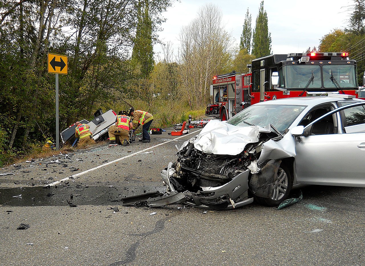 Medic units from Port Ludlow Fire & Rescue and East Jefferson Fire-Rescue respond to a two-vehicle accident at the intersection of state Highway 19 and Oak Bay Road on Friday. (Port Ludlow Fire & Rescue)