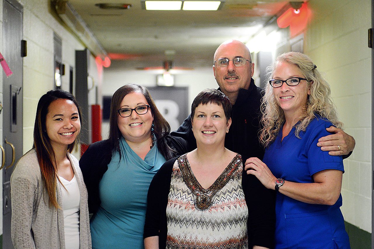 The Clallam County jail’s medical team is the first on the West Coast and the only in the state to treat heroin addicts with Suboxone. From left are Nurses Celestinna Davidson and Candace Priest, social worker Stephanie Diltz, doctor Art Tordini and Health Services Administrator Julia Keegan. (Jesse Major/Peninsula Daily News)