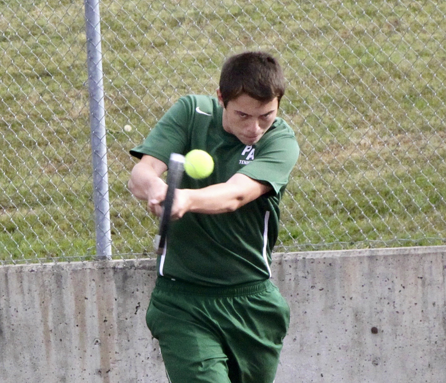 Dave Logan/for Peninsula Daily News                                Port Angeles’ No. 2 singles player Tyler Nickerson hits a return during his match against Chimacum’s Nate Miller. Nickerson won 6-0, 6-2.