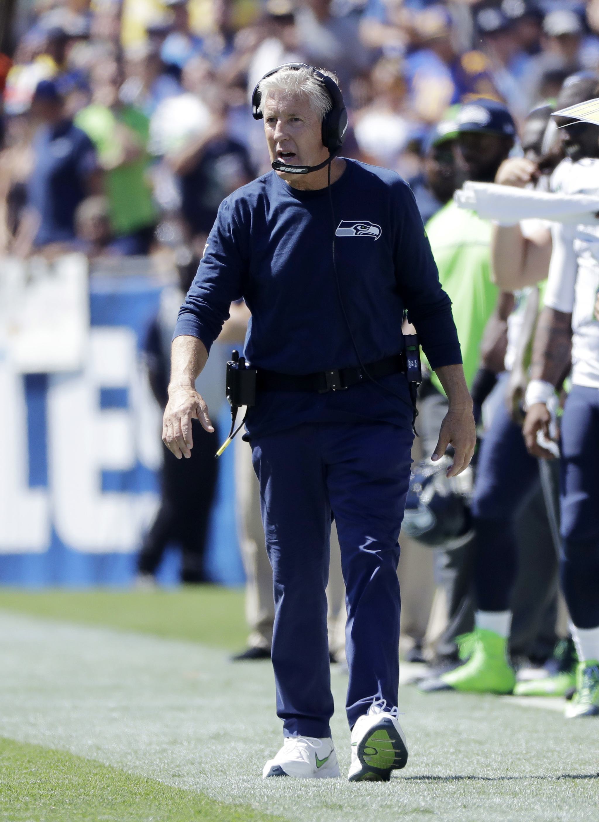 Seattle Seahawks head coach Pete Carroll walks the sideline during the first half an NFL football game against the Los Angeles Rams at Los Angeles Memorial Coliseum, Sunday, Sept. 18, 2016, in Los Angeles. (AP Photo/Jae Hong)