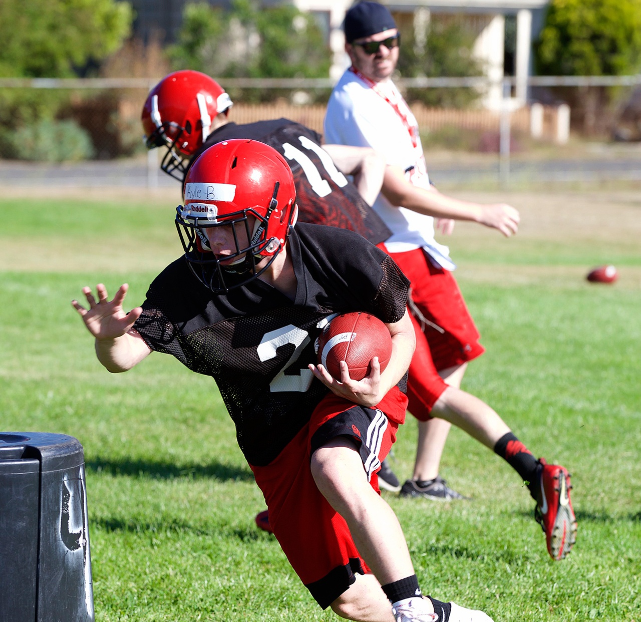 Steve Mullensky/for Peninsula Daily News Port Townsend’s Kyle Blankenship runs with the ball during a preseason practice at Flint Field.