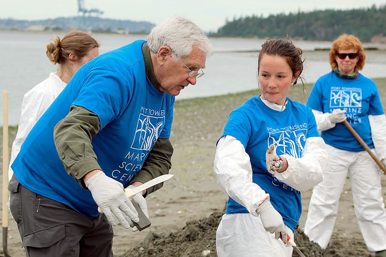 Dr. Pete Schroeder with Katie Conroy, Port Townsend Marine Science Center AmeriCorps member, prepare a gray whale skeleton forr underwater decomposition. (Port Townsend Marine Science Center)