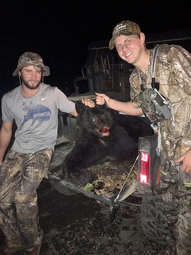 Parker Browning (right) and his hunting partner Reece Hagen, both of Forks, show off Browning’s first bear harvest. Hagen spotted the bear first from about 100-yards away. Browning dropped it with one shot.