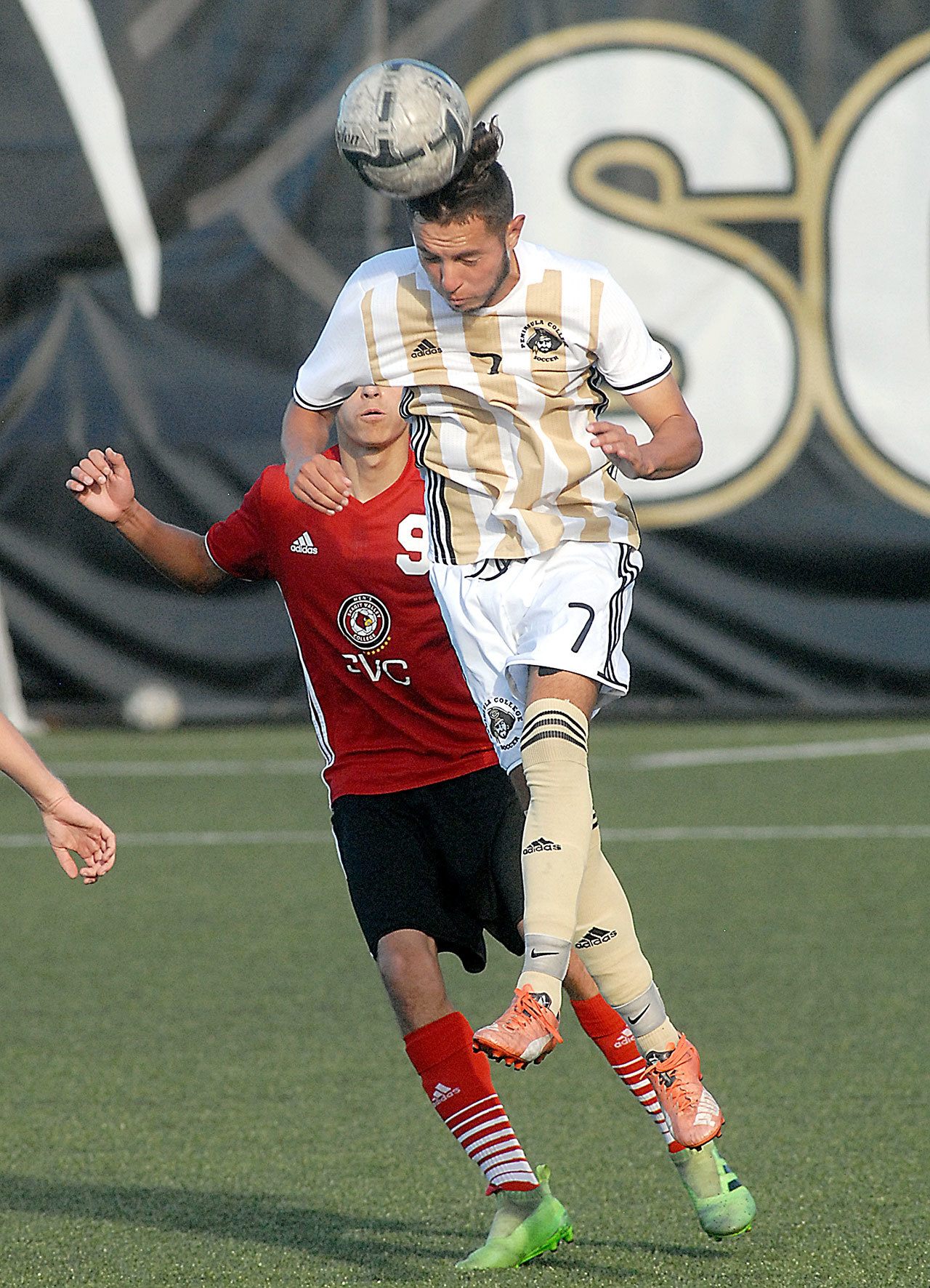 Keith Thorpe/Peninsula Daily News Peninsula’s Miguel Valderrama steps in front of Skagit Valley’s Artmando Farias in first-half action on Wednesday in Port Angeles.