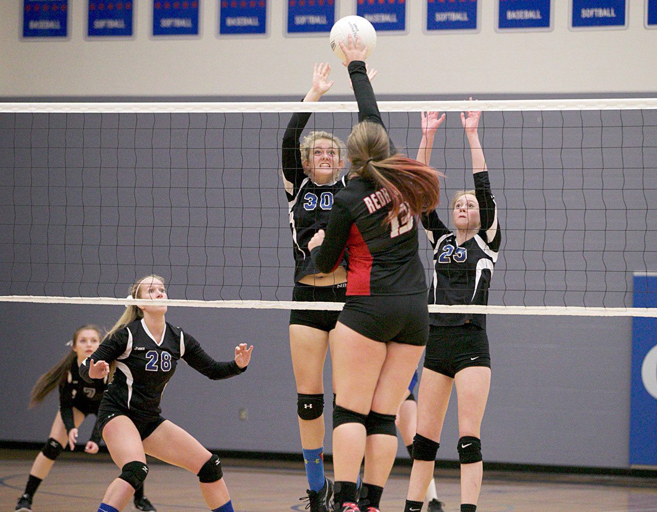Steve Mullensky/for Peninsula Daily News Chimacum’s Chloe Patterson, 30, and Kyla Gates, 25, get set to block a shot by Port Townsend’s Torriana Minnahan, 13, during action in a game on Tuesday in Chimacum.