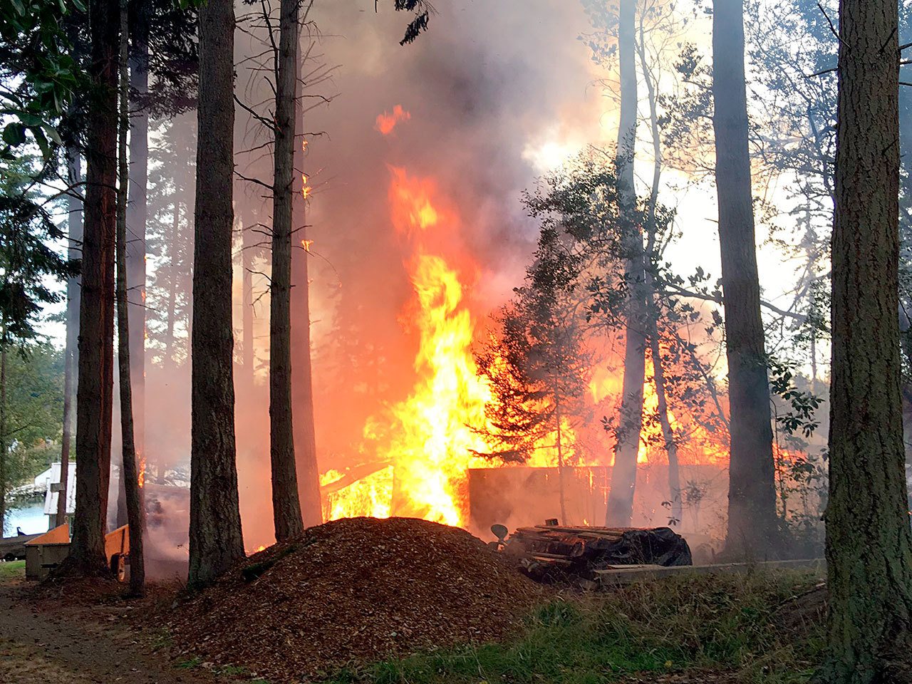 A structure fire destroyed an outbuilding on Griffiths Point Road on Marrowstone Island on Wednesday. (East Jefferson Fire-Rescue)