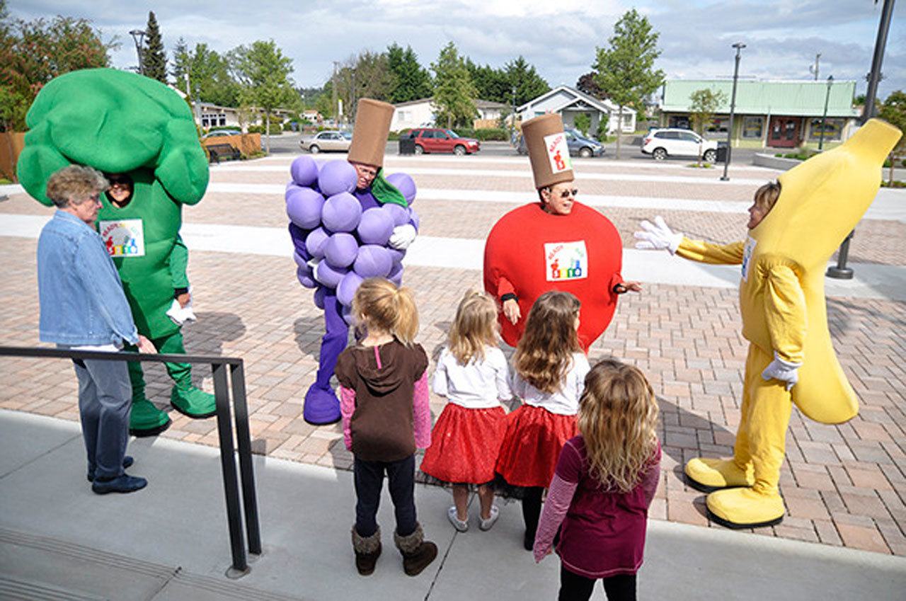 From left, Healthy Community Coalition advocate Bertha Cooper, joins fruits and vegetables Judy Hubers-Brandt (broccoli), Jim Ragan (grapes), Joanne Stewart (apple) and Gayle Selby (banana) at a Sequim-Dungeness Valley Healthy Community Coalition event in April. This October, they partner with the YMCA of Sequim to offer the Ready, Set, Go, 5-2-1-0 Challenge to encourage healthier living. (Michael Dashiell/Olympic Peninsula News Group)