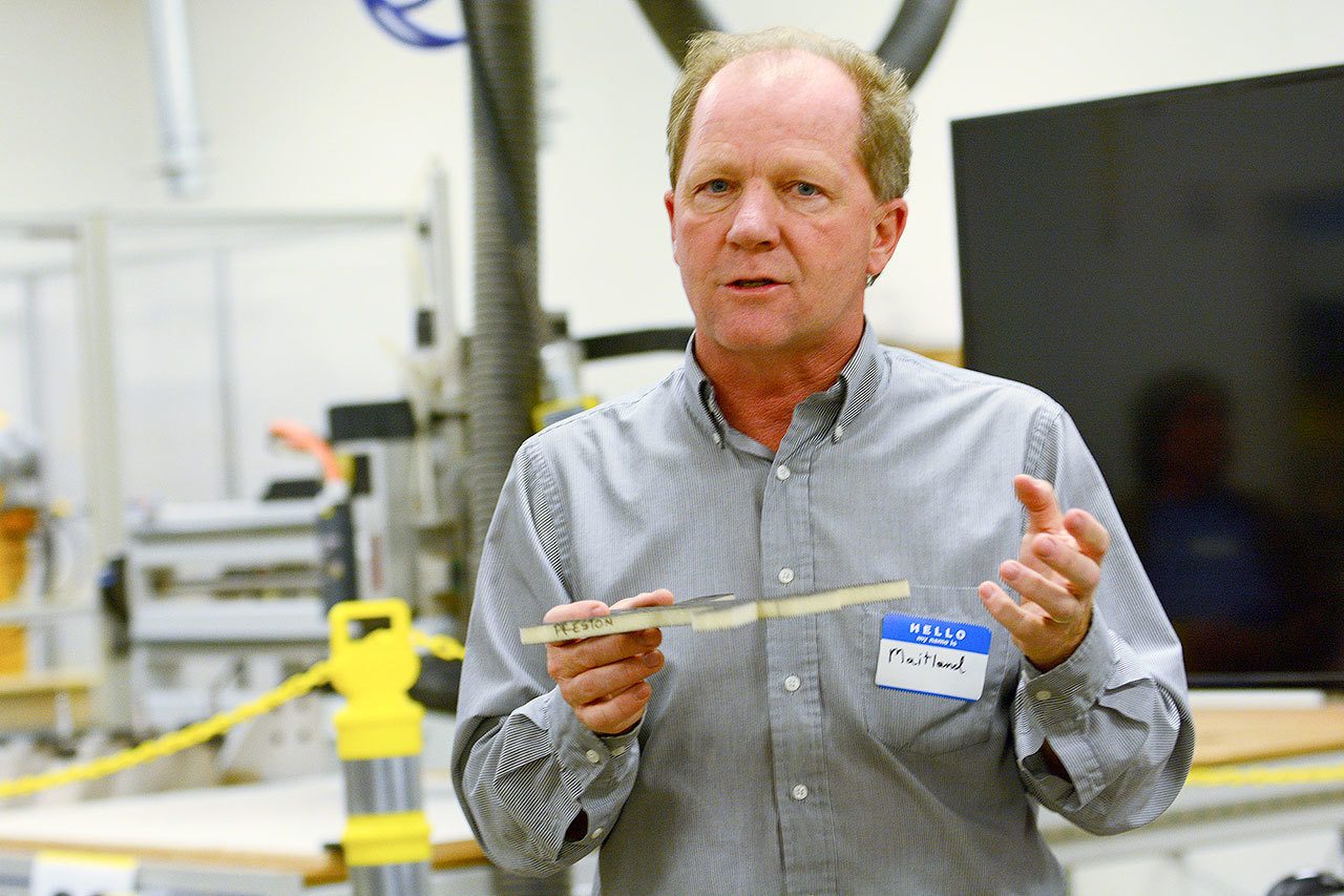 Maitland Peet, advanced manufacturing program coordinator for Peninsula College, leads a group on a tour during an open house at the Composite Recycling Technology Center in Port Angeles on Tuesday evening. (Jesse Major/Peninsula Daily News)
