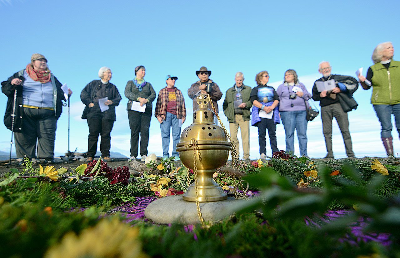 About 60 people form a circle at the mouth of the Elwha River, say prayers and sing songs to show solidarity Thursday with the Standing Rock Sioux Tribe in its efforts to prevent the Dakota Access Pipeline from crossing the Missouri River. (Jesse Major/Peninsula Daily News)