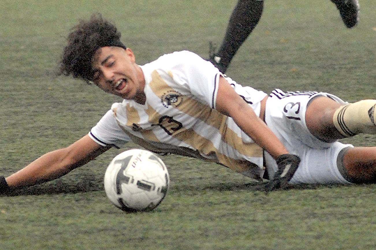 PENINSULA SOCCER: Women win playoff opener, but men fall short in shootout