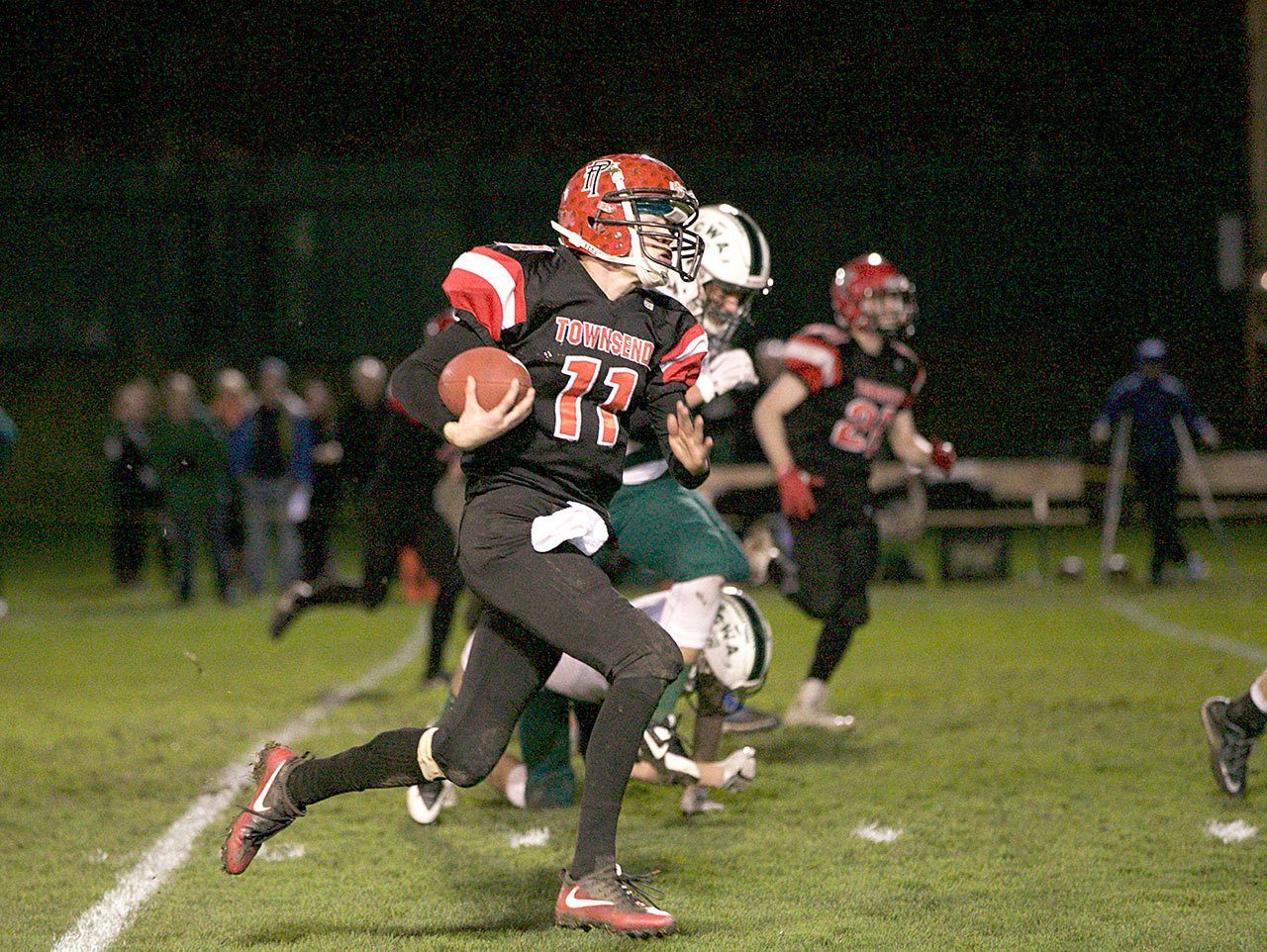 Steve Mullensky/for Peninsula Daily News Port Townsend’s Berkley Hill rushes against Charles Wright on Nov. 5 at Memorial Field. Hill was named the Olympic-Nisqually 1A MVP Tuesday.