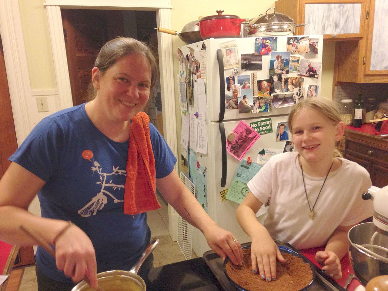 Carrie Sanford/for Peninsula Daily News Carrie Sanford and her daughter, Abby, prepare pies together in 2014.