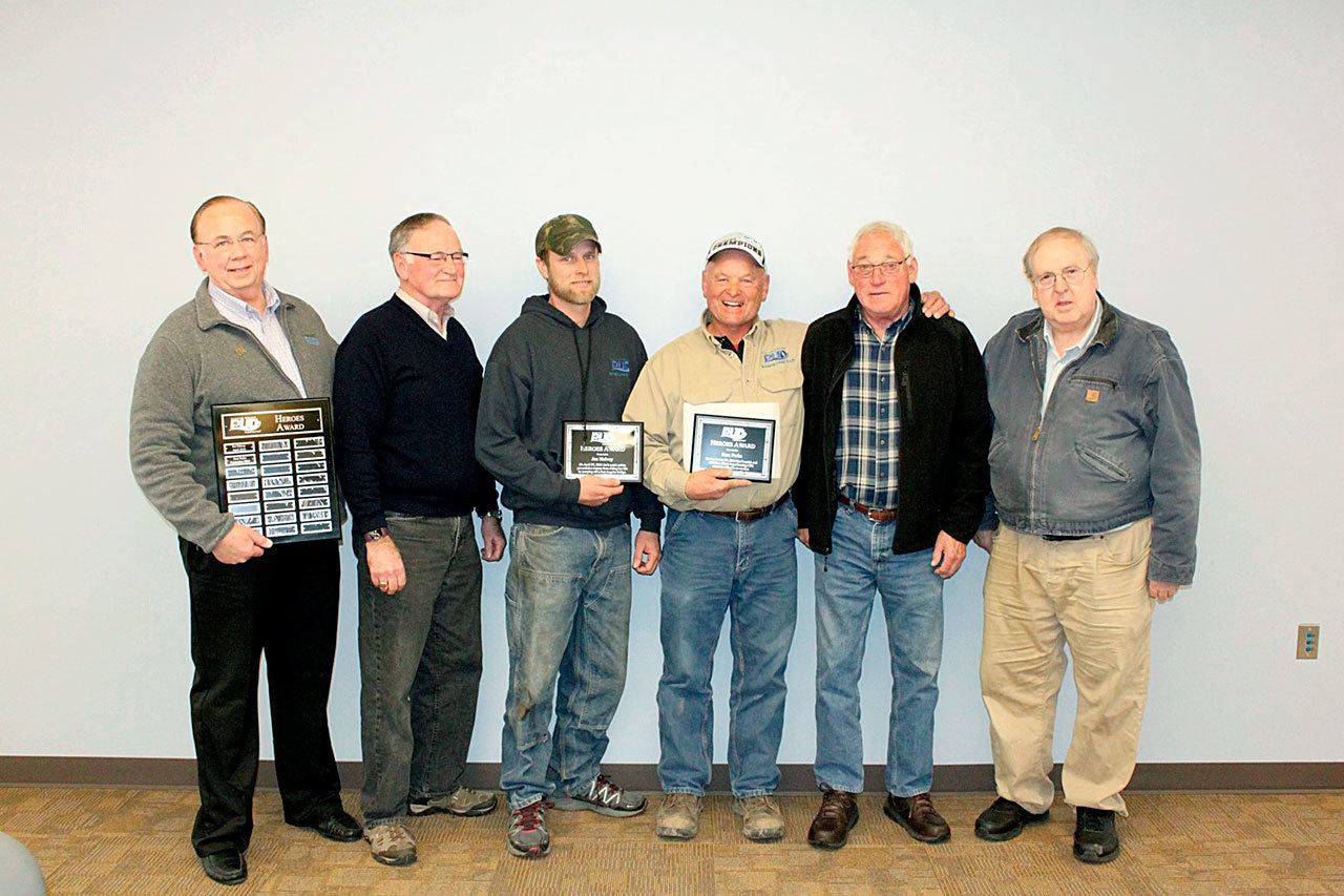 From left are Clallam County Public Utility District General Manager Doug Nass, Commissioner Will Purser, Joe Helvey, Sam Parks, Commissioner Ted Simpson and Commissioner Hugh Haffner.