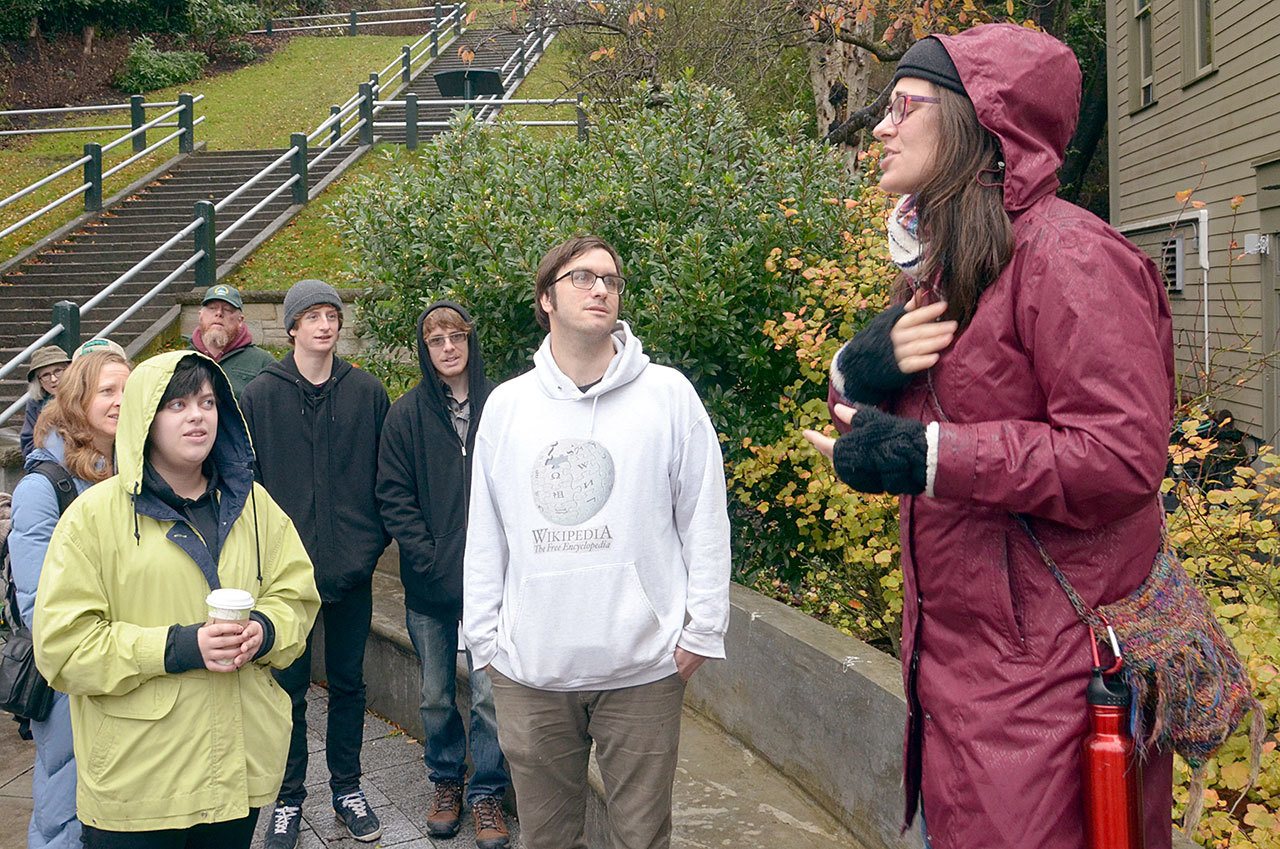 Zhaleh Almaee Weinblatt of the Mandala Center for Change in Port Townsend leads roughly two dozen community members in a song during the Rally Against Hate on Saturday morning. (Cydney McFarland/Peninsula Daily News)