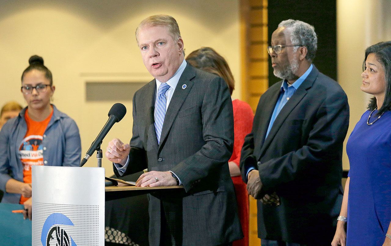 Seattle Mayor Ed Murray, second from left, speaks at a post-election event of elected officials and community leaders at City Hall in Seattle on Nov. 9. Leaders in Seattle, San Francisco and other so-called “sanctuary cities” say they won’t change their stance on immigration despite President-elect Donald Trump’s vows to withhold potentially millions of dollars in taxpayer money if they don’t cooperate. (Elaine Thompson/The Associated Press)