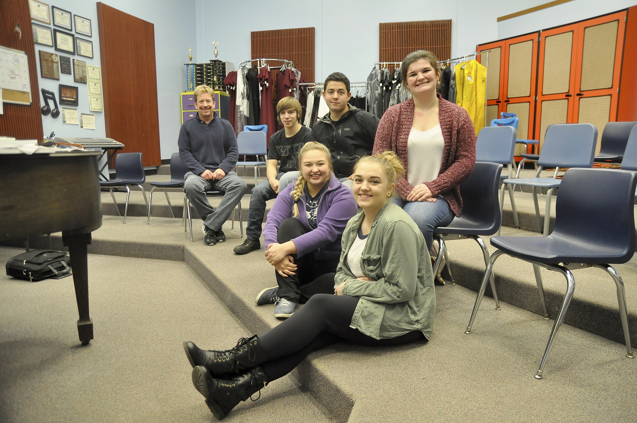 Led by choir instructor John Lorentzen (far left), five Sequim High School students are headed to New York in February to take part in the Honors Performance Festival. They include, from left, Thomas Arnesen, Silas Baird, Victoria Hall (seated), Tomi Wilson (seated) and Colleen Carpenter. (Michael Dashiell/Olympic Peninsula News Group)