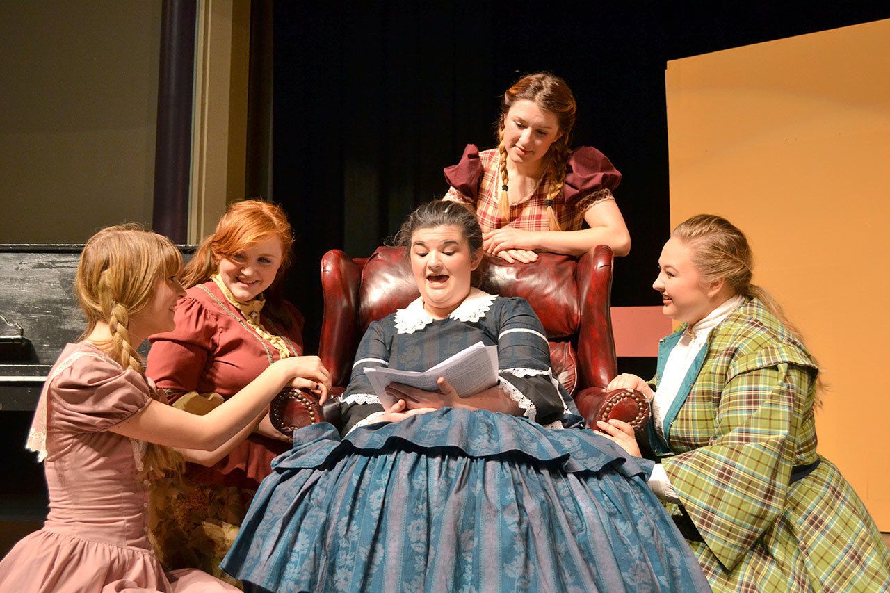 Marmee, played by Colleen Carpenter, reads to her daughters, from left, Amy (Alison Cobb), Amy (Abygail Mundy), Jo (Audrey Hughes) and Meg (Victoria Hall). (Matthew Nash/Olympic Peninsula News Group)