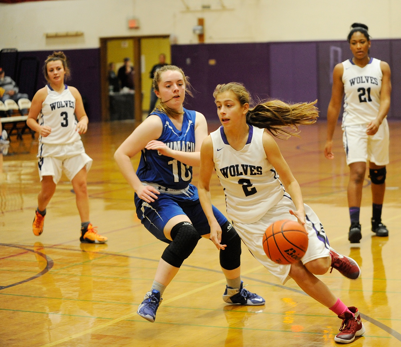 Michael Dashiell/Olympic Peninsula News Group Sequim’s Jessica Dietzman, right, drives to the hoop while defended by Chimacum’s Maddie Dowling.