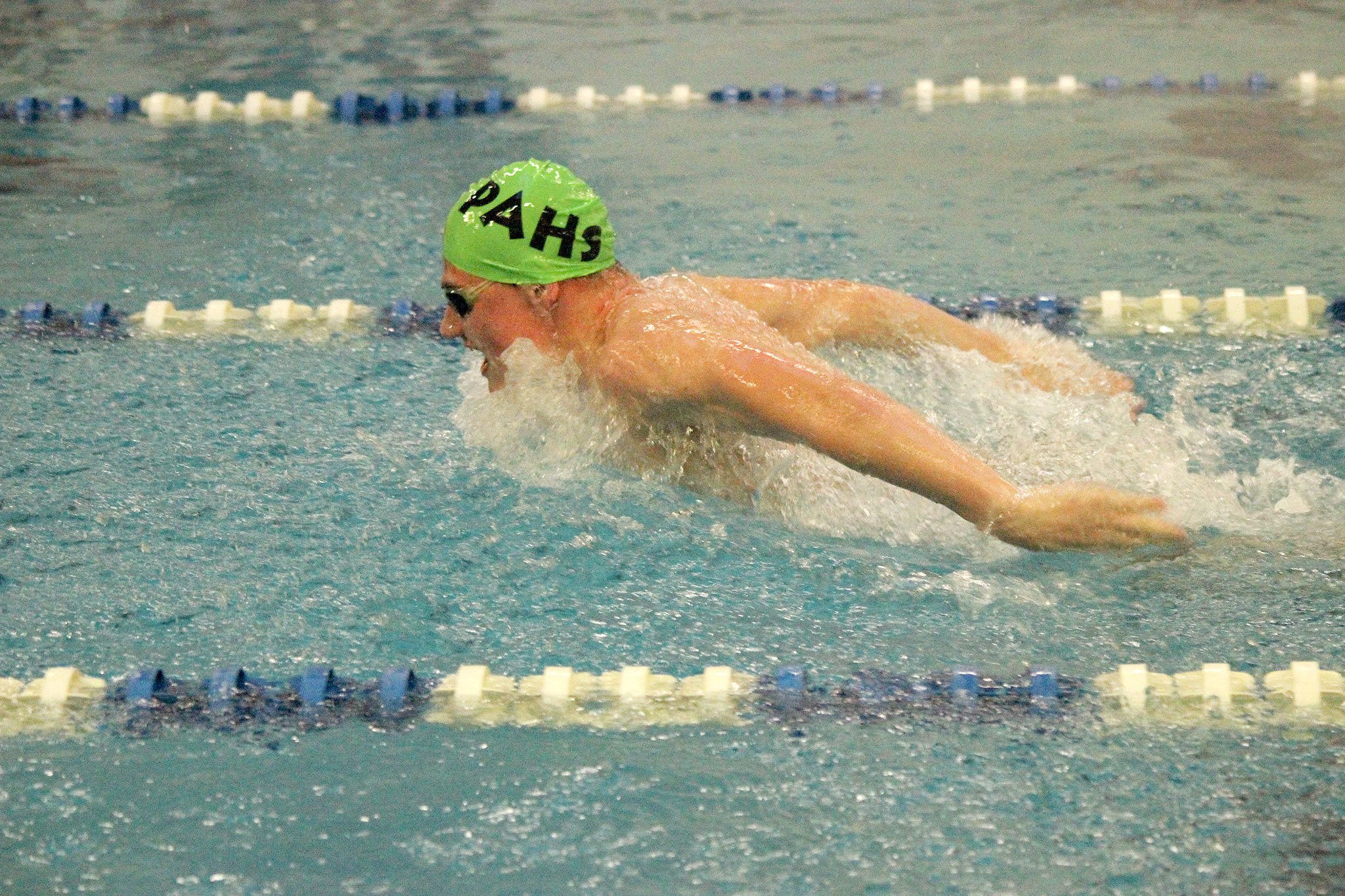 Patty Reifenstahl/for the Peninsula Daily News Port Angeles’ Tristin Butler competes in the 100-yard butterfly against Olympic High on Thursday.