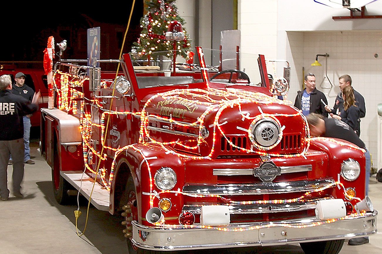 Firefighters on decorated engines collect donations in Port Angeles, Sequim