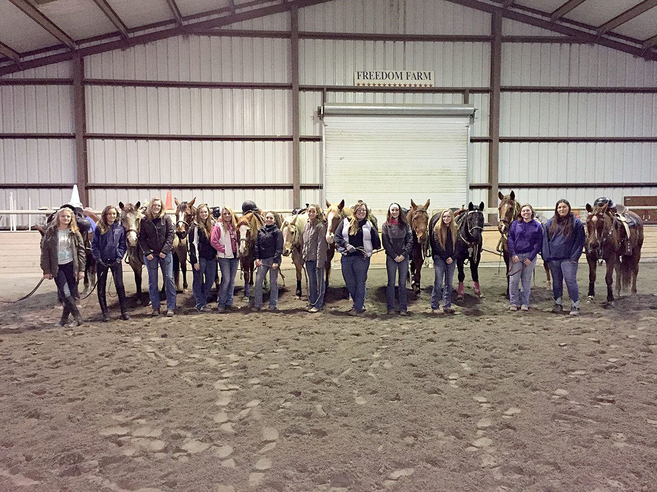 This year’s Sequim High School equestrian team members are Faith Haggie, Grace Niemeyer, Emelie Fürste, Amy Tucker, Christina Williams, Miranda Williams, Yana Hoesel, Amanda Murphy, Sydney Balkan, Abi Payseno, Madi Murphy and Lilly Thomas. The girls are show at a training session at Freedom Farm in Port Angeles. (Katie Solomon-Newton)