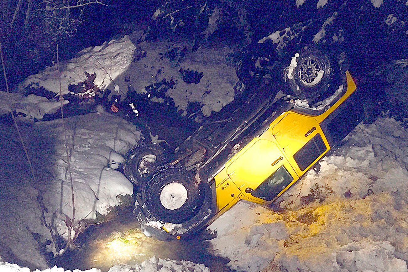 Jeep slides off Black Diamond Road, rolls over