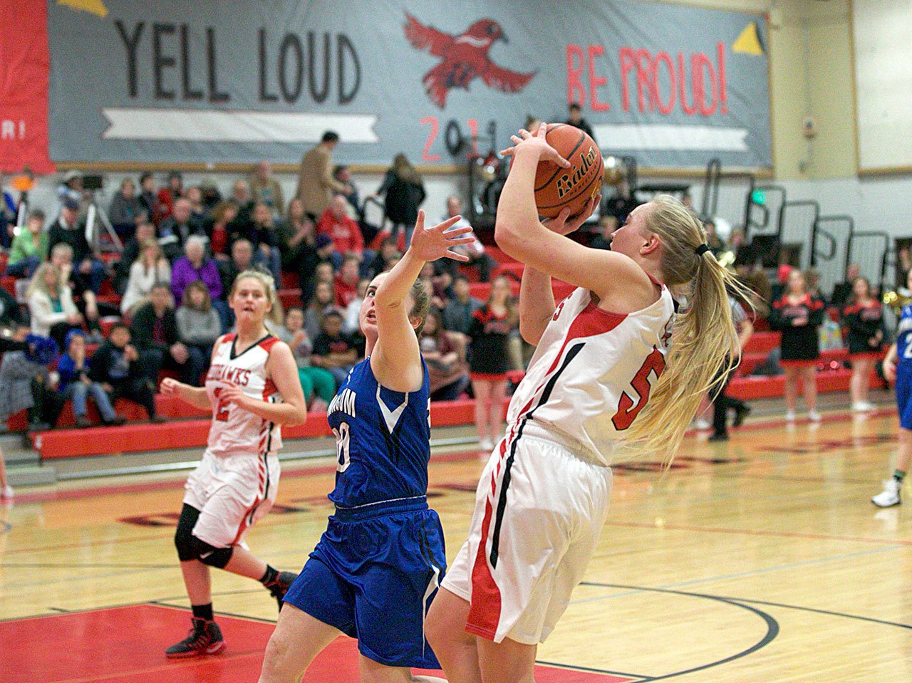 Steve Mullensky/for Peninsula Daily News Port Townsend’s Kaitlyn Meek goes up for a shot and over the outstretched arm of Chimacum’s Maddie Dowling during a game on Tuesday in Port Townsend.