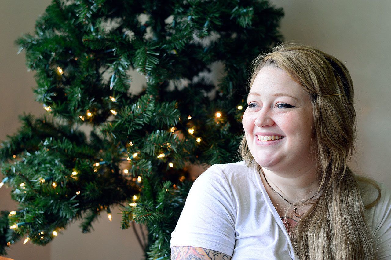 Anastasia Webster smiles in her new home after her family received enough from the Peninsula Home Fund to add to their savings and have enough for a deposit. (Diane Urbani de la Paz/for Peninsula Daily News)