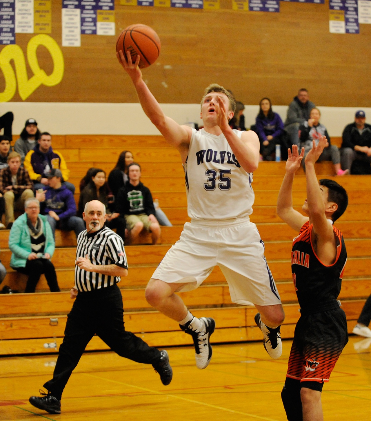 Michael Dashiell/Olympic Peninsula News Group Sequim’s Riley Cowan, left, puts up a layup during the Wolves’ 60-45 loss to Centralia.                                Michael Dashiell/Olympic Peninsula News Group Sequim’s Riley Cowan, left, puts up a layup during the Wolves’ 60-45 loss to Centralia.