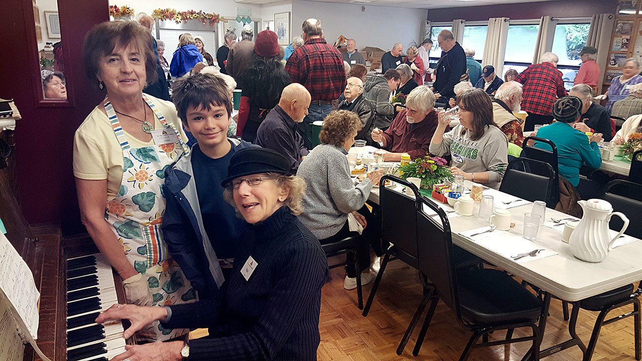 Volunteers Nan Toby, Diego Garcia and Diona Smith helped serve food and provide a welcome atmosphere at the free Thanksgiving meal earlier this year. (East Jefferson Rotary)