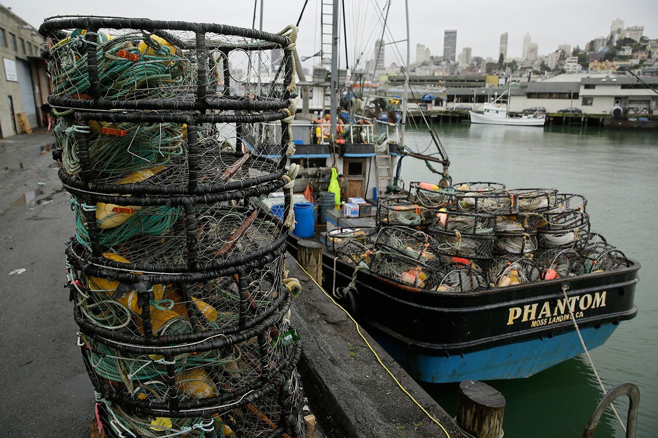 Eric Risberg/The Associated Press Crab pots sit on a processing pier and the back of a boat at Fisherman’s Wharf on Tuesday in San Francisco.