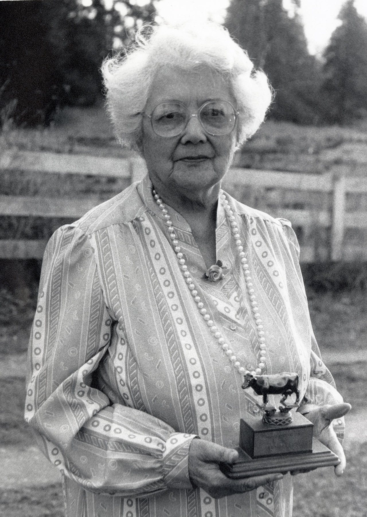 Josephine Yarr in 1988 holds an award received for dairy cow milk production. (Jefferson County Historical Society)