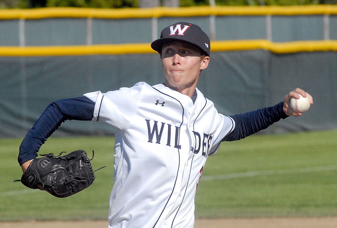 Keith Thorpe/Peninsula Daily News Wilder’s Curan Bradley pitches during a July 2016 game at Port Angeles Civic Field.