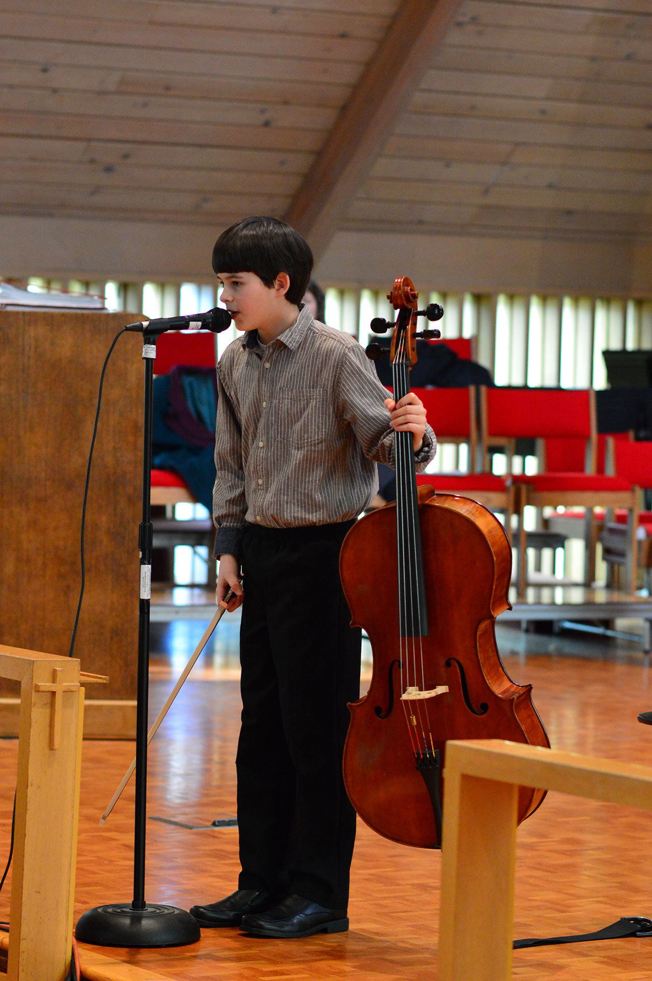 Adlai Erickson, 11, a winner of Saturday’s Young Artist Competition, introduces himself to the judges at Holy Trinity Lutheran Church in Port Angeles.