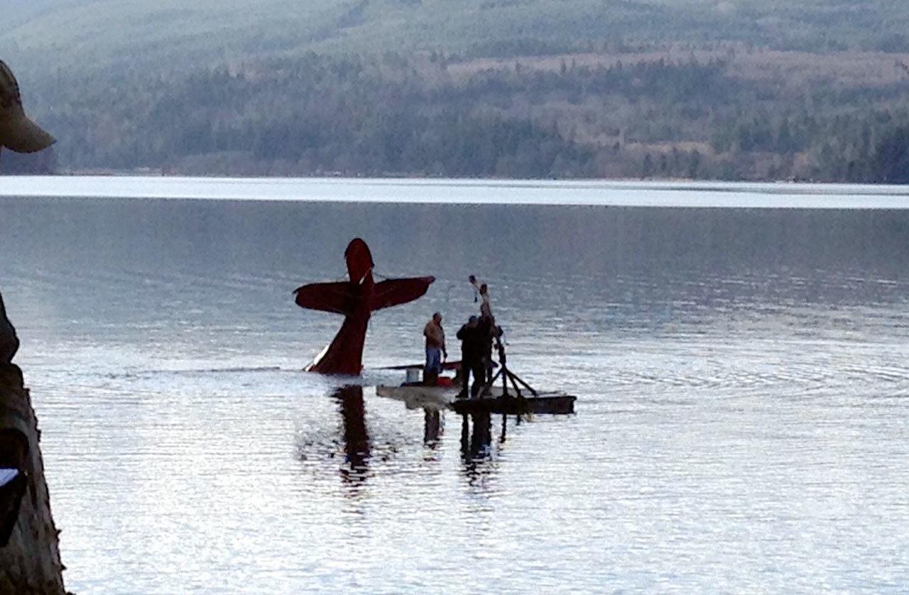 A downed plane in Discovery Bay is towed to shallow water by a commercial vessel that responded to the scene. (East Jefferson Fire-Rescue)