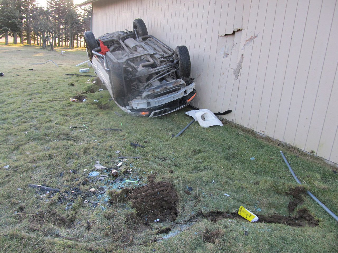 A woman was injured in this one-vehicle roll over wreck early Saturday morning on Old Olympic Highway near Sequim. (Deputy Brandon Stoppani/Clallam County Sheriff’s Office)