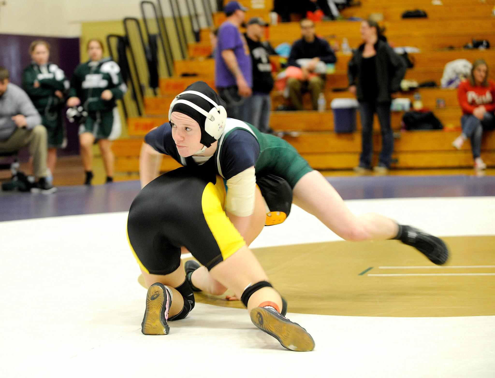 Matthew Nash/Olympic Peninsula News Group Port Angeles’ Alyssa Sweet at 130 pounds works her way to a pin over Lincoln’s Kayla Hoy in 3:05 of her match Saturday at SequimHigh School during the 2A District C sub-regional girls wrestling tournament.