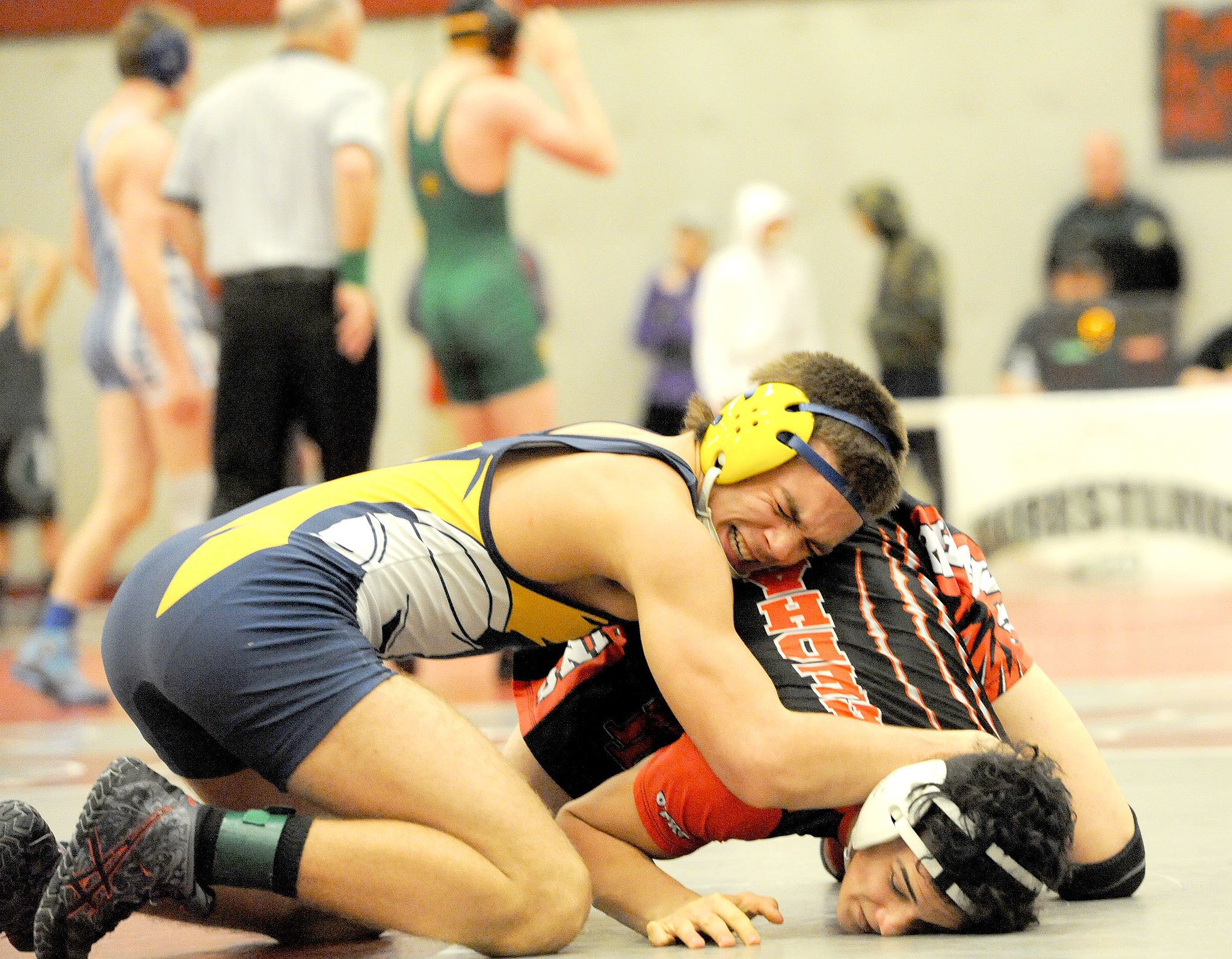 Lonnie Archibald/for Peninsula Daily News Forks’ Garrison Schumack, left, wrestles against Port Townsend’s Henry Veittenhans at the Region 1 1A Wrestling Tournament in Hoquiam on Saturday. Schumack won match and went on to take first place in the 145-weight division, while Veittenhans finished fourth. Both wrestlers qualified for the Mat Classic at the Tacoma Dome Feb. 17-18.