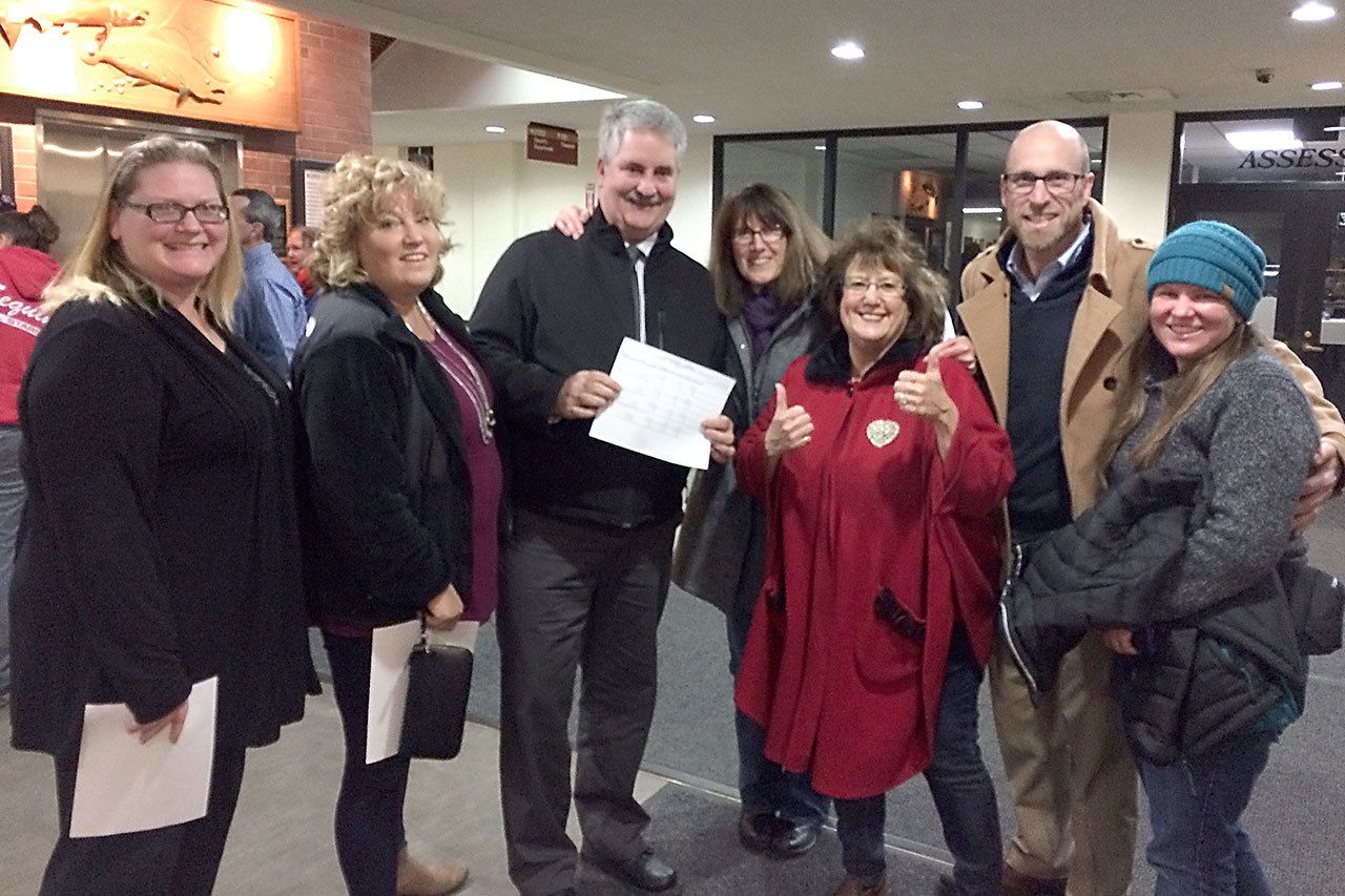 From left after Tuesday’s election are Brianne Barrett, Port Angeles School District director of special services; Lisa Lisk, Dry Creek teacher; Chuck Lisk, PASD assistant superintendent of teaching and learning; Tina Smith-O’Hara, PASD communications and community relations coordinator; Cindy Kelly, PASD School Board director; Steve Methner, co-chair of Port Angeles Citizens for Education (PACE); and Carrie Sanford, PACE member.