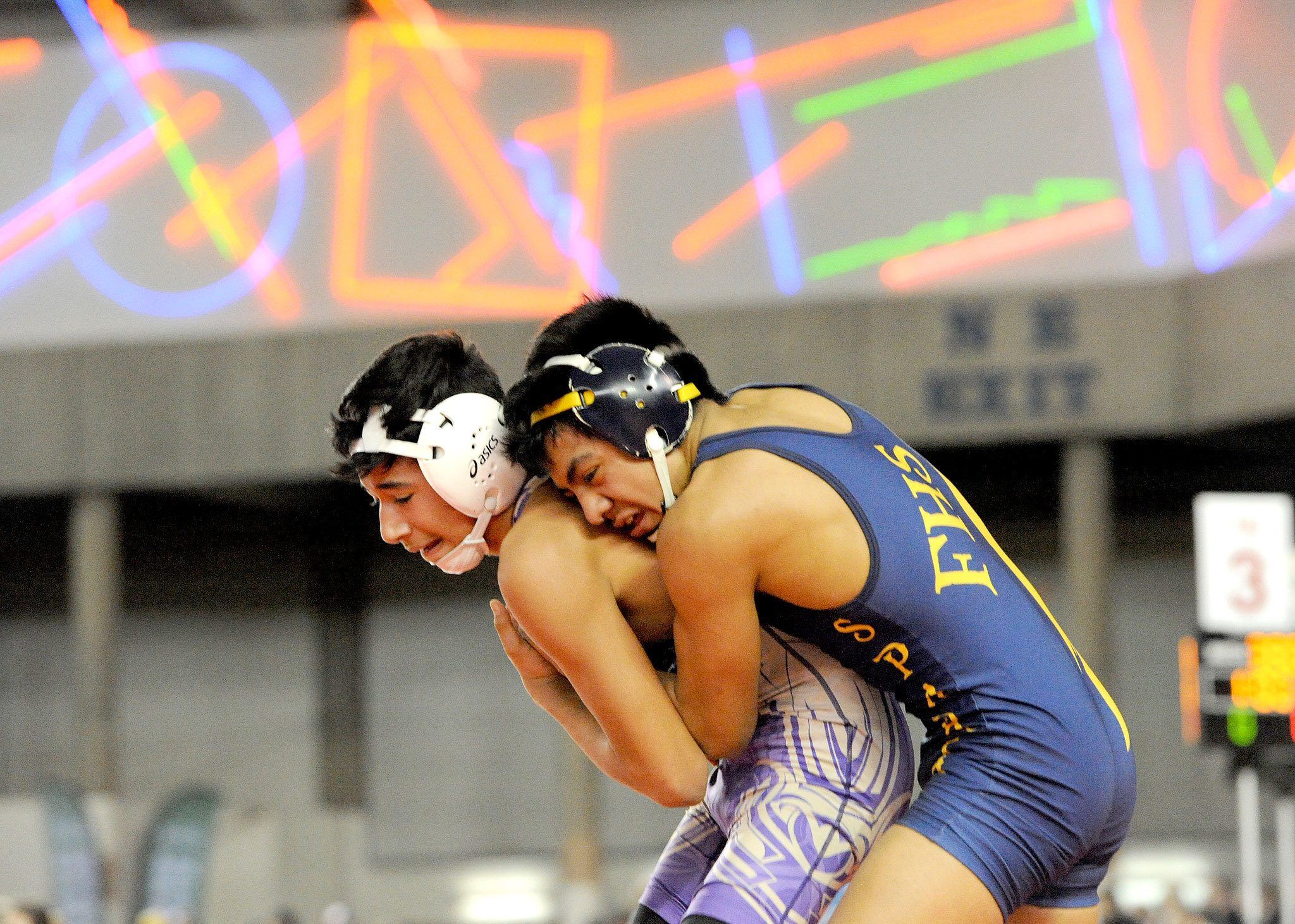 Lonnie Archibald/for Peninsula Daily News Forks’ Josue Lucas defeated Johnathan Magana of Connell to earn the Class 1A 106-pound state wrestling championship last Saturday.