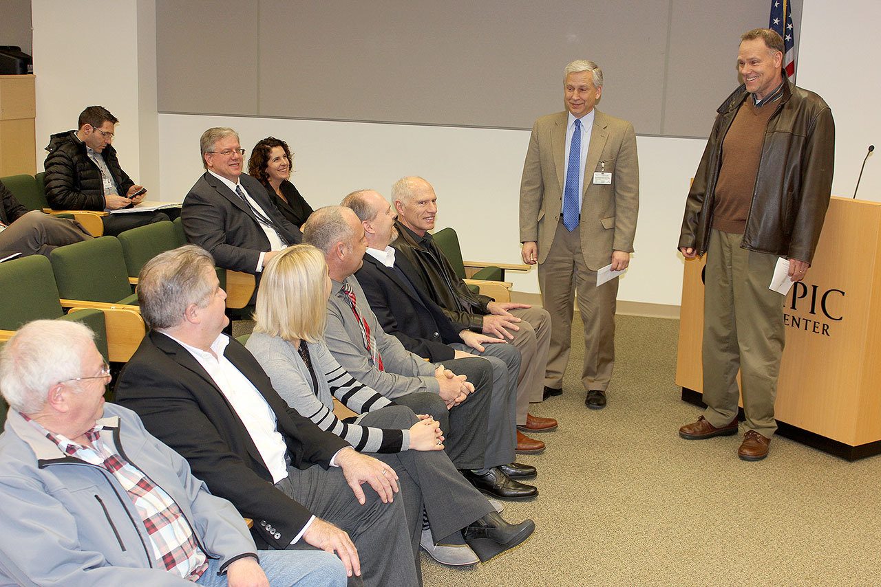 Olympic Medical Center CEO Eric Lewis, standing left, and OMC Foundation President Jim Jones, standing right, thanked several donors and sponsors for their support at the Feb. 15 hospital commissioner’s meeting. Seated in the front row, from left, are Bill Hermann of Hermann Brothers Logging; Larry Hueth, First Federal; Mary and Todd Irwin, Irwin Dental; Dan Wilder Jr., Wilder Auto Group; and Bill Littlejohn of Littlejohn Companies.