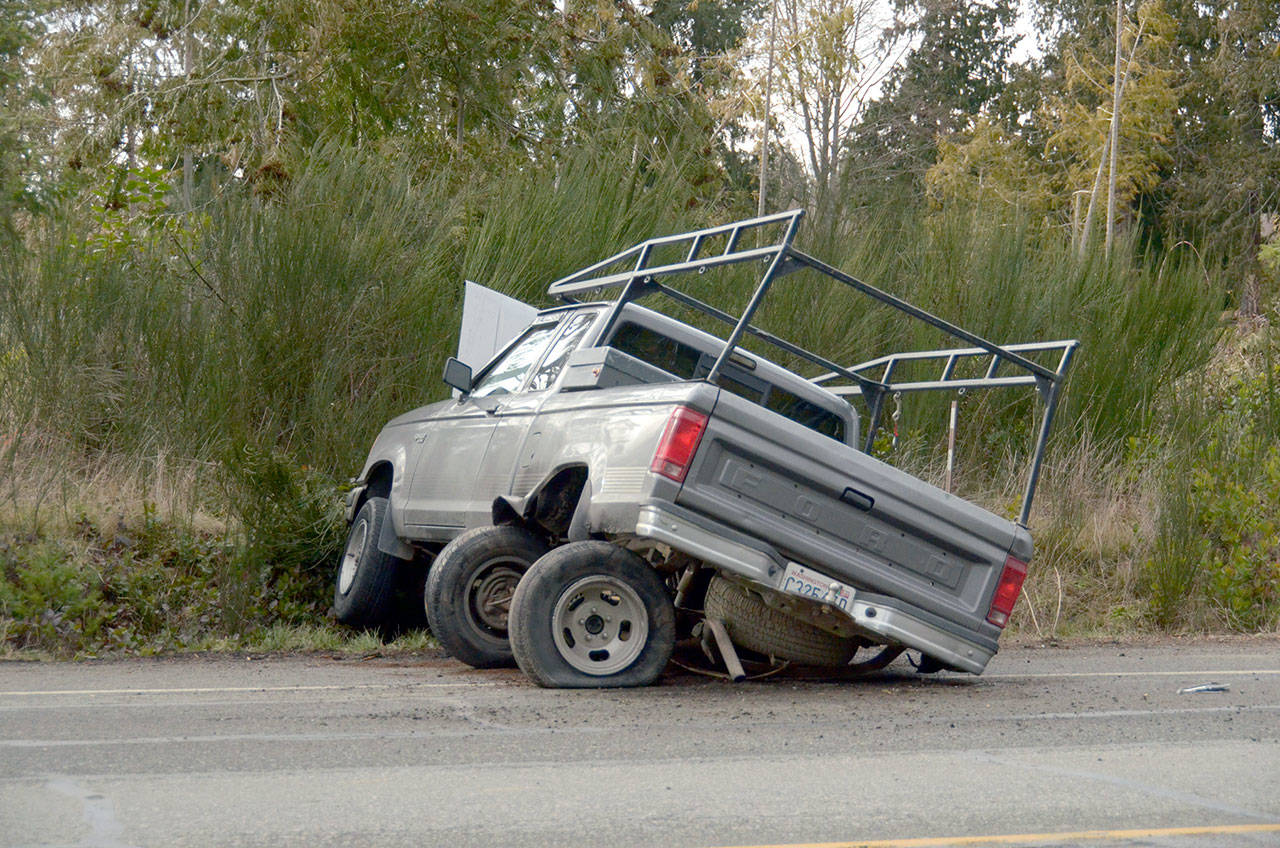 A two-car wreck at the intersection of Four Corners Road and state Highway 20 near Port Hadlock blocked traffic for roughly a half-hour while crews cleared the roadway. No one was injured in the wreck. (Cydney McFarland/Peninsula Daily News)