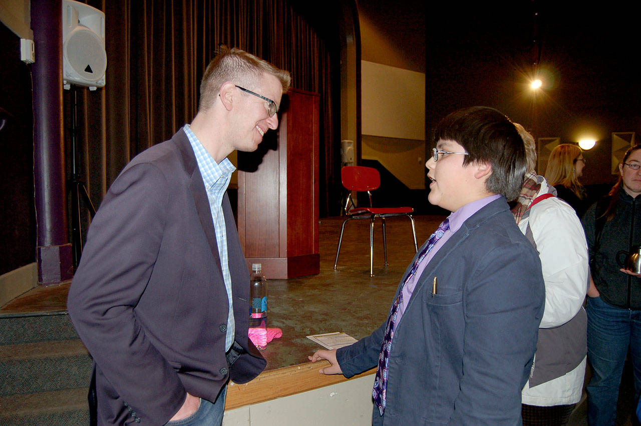 U.S. Rep. Derek Kilmer talks to Aidan Lara, 12, about education after the town hall held at the Sequim High School auditorium Monday. (Erin Hawkins/Olympic Peninsula News Group)